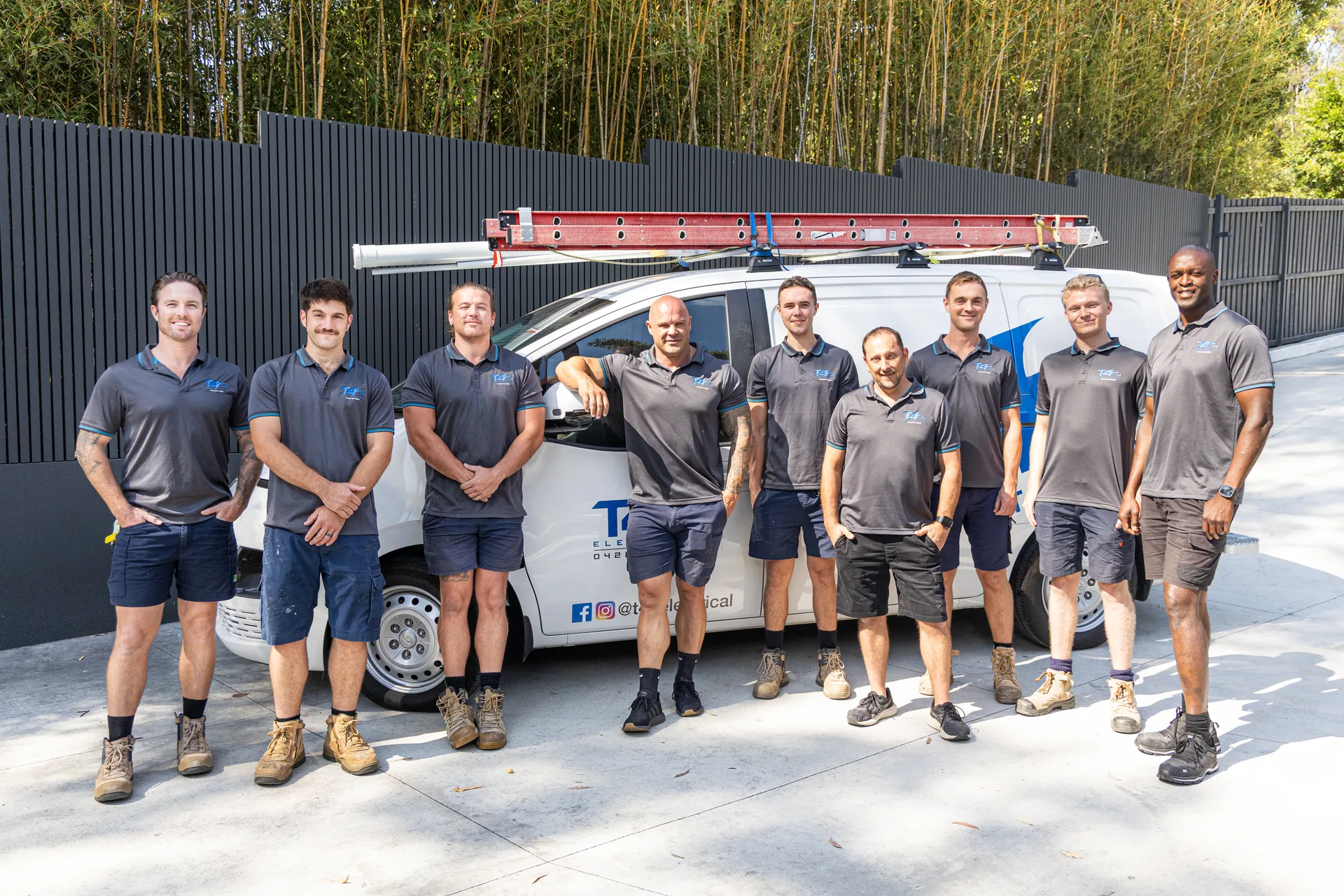 The Family Electrician Coolangatta team with a service van